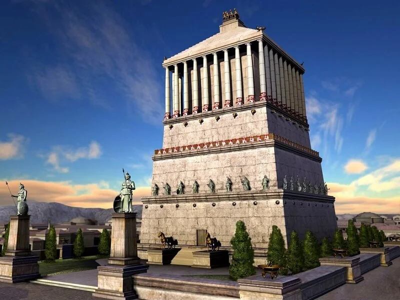 Close-up of surviving fragments of sculptures from the Mausoleum at Halicarnassus, displaying intricate details.