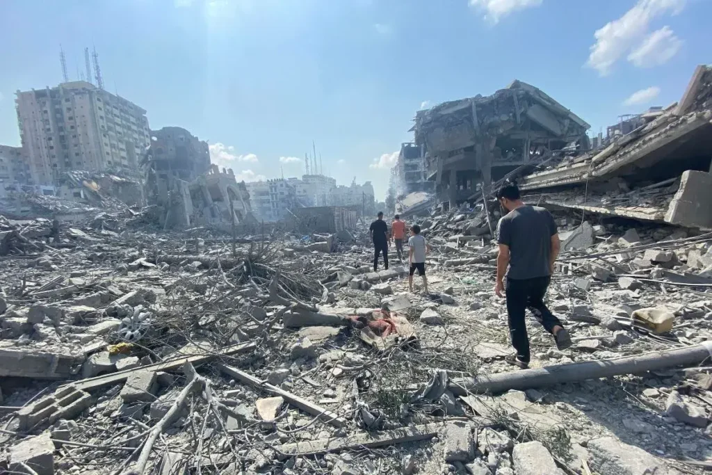 Volunteers distributing food and water to the needy in Gaza's devastated landscapes