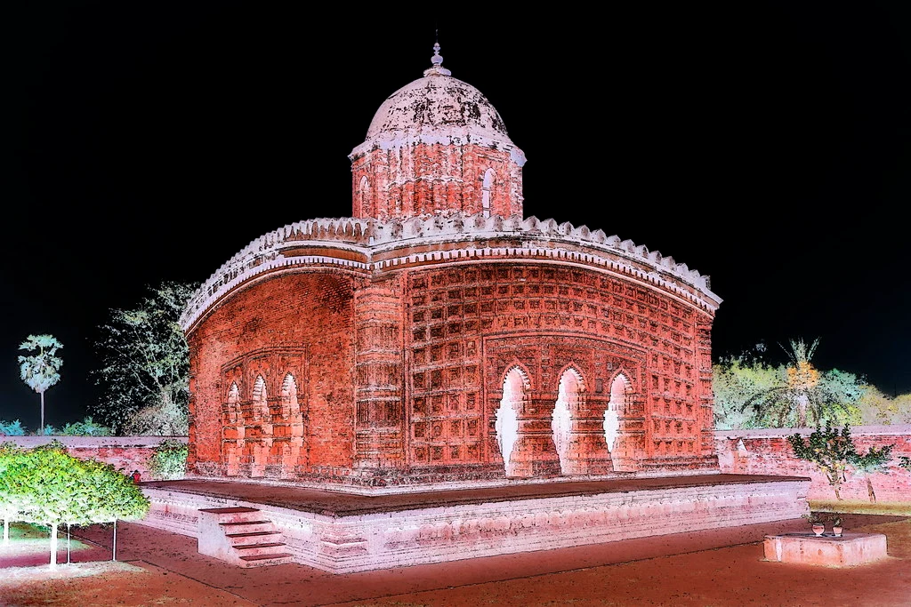 Madan Mohan Temple, dedicated to Lord Krishna, features elaborate terracotta carvings on its walls