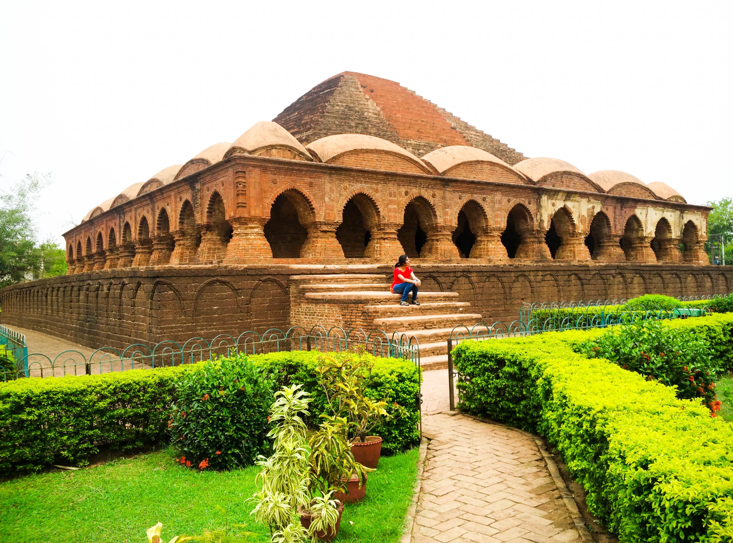 bishnupur temples: Rasmancha, a pyramidal temple adorned with intricate terracotta sculptures, showcases architectural brilliance.