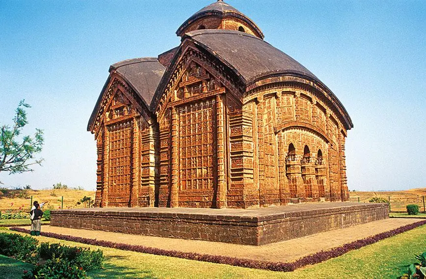 Jor Bangla Temple, characterized by curved roofs and vibrant terracotta panels, depicts tales from Hindu epics.