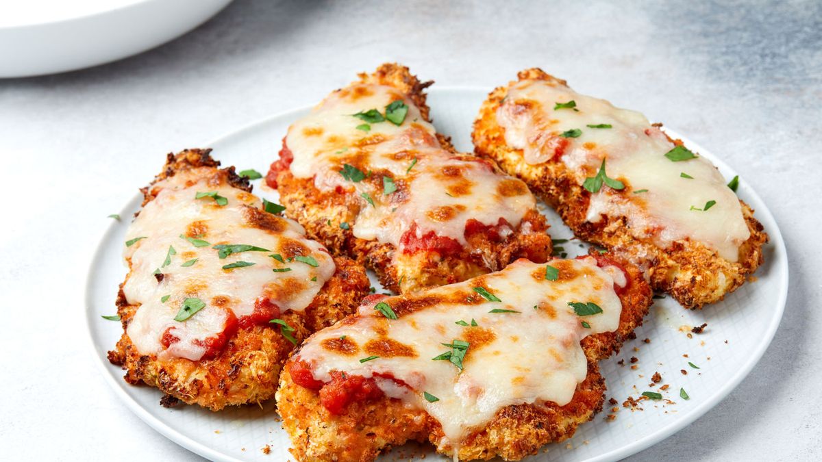 The breading process is pivotal in creating the iconic texture of Chicken Parmigiana