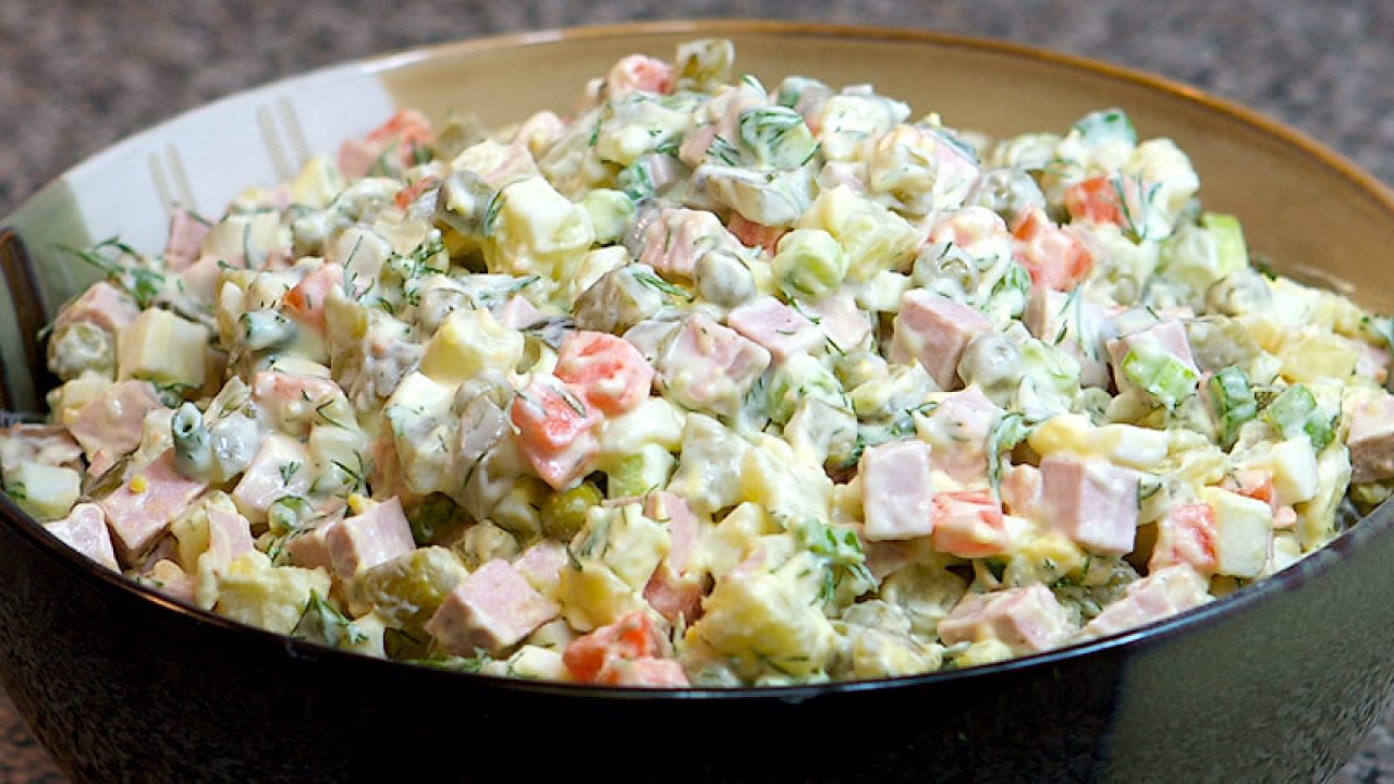 a bowl of salad with mayonnaise