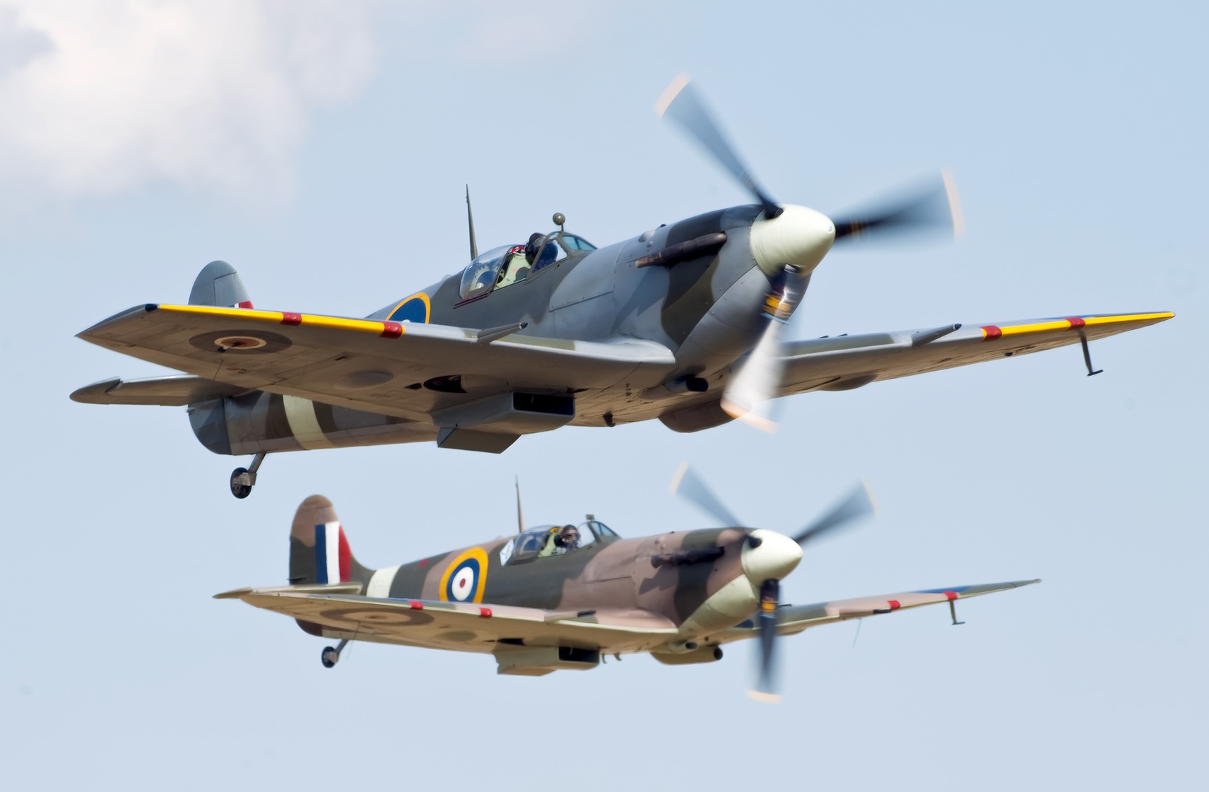 Supermarine Spitfire pilots preparing for takeoff during WWII. 